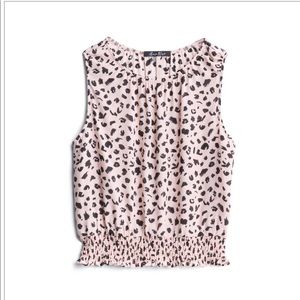 Alice blue polyester smocked spot detail blouse.